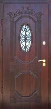 Фото двери с ковкой и МДФ